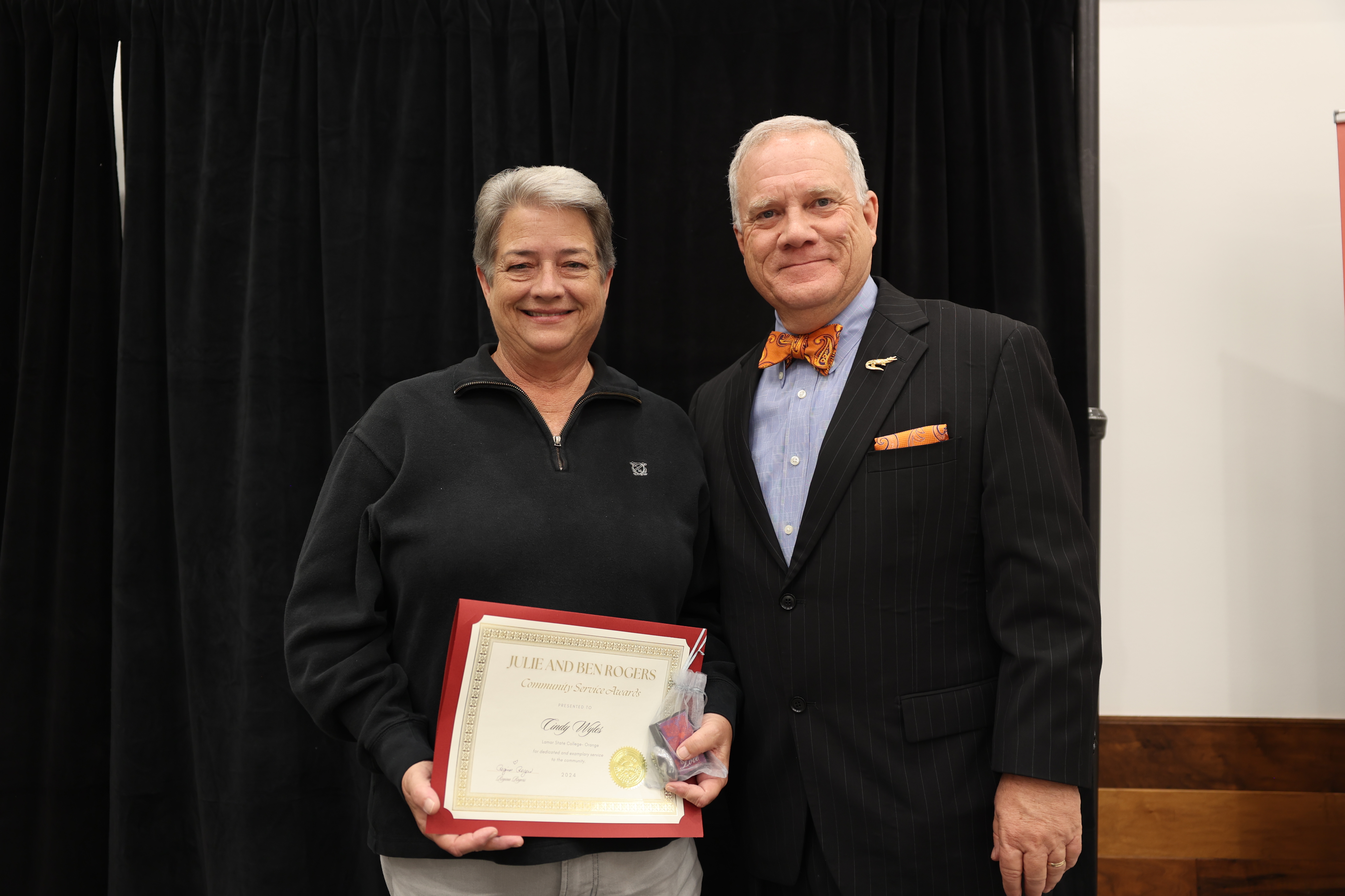 Cindy Wyles accepts the Ben an Julie Rogers Award with Dr. Johnson