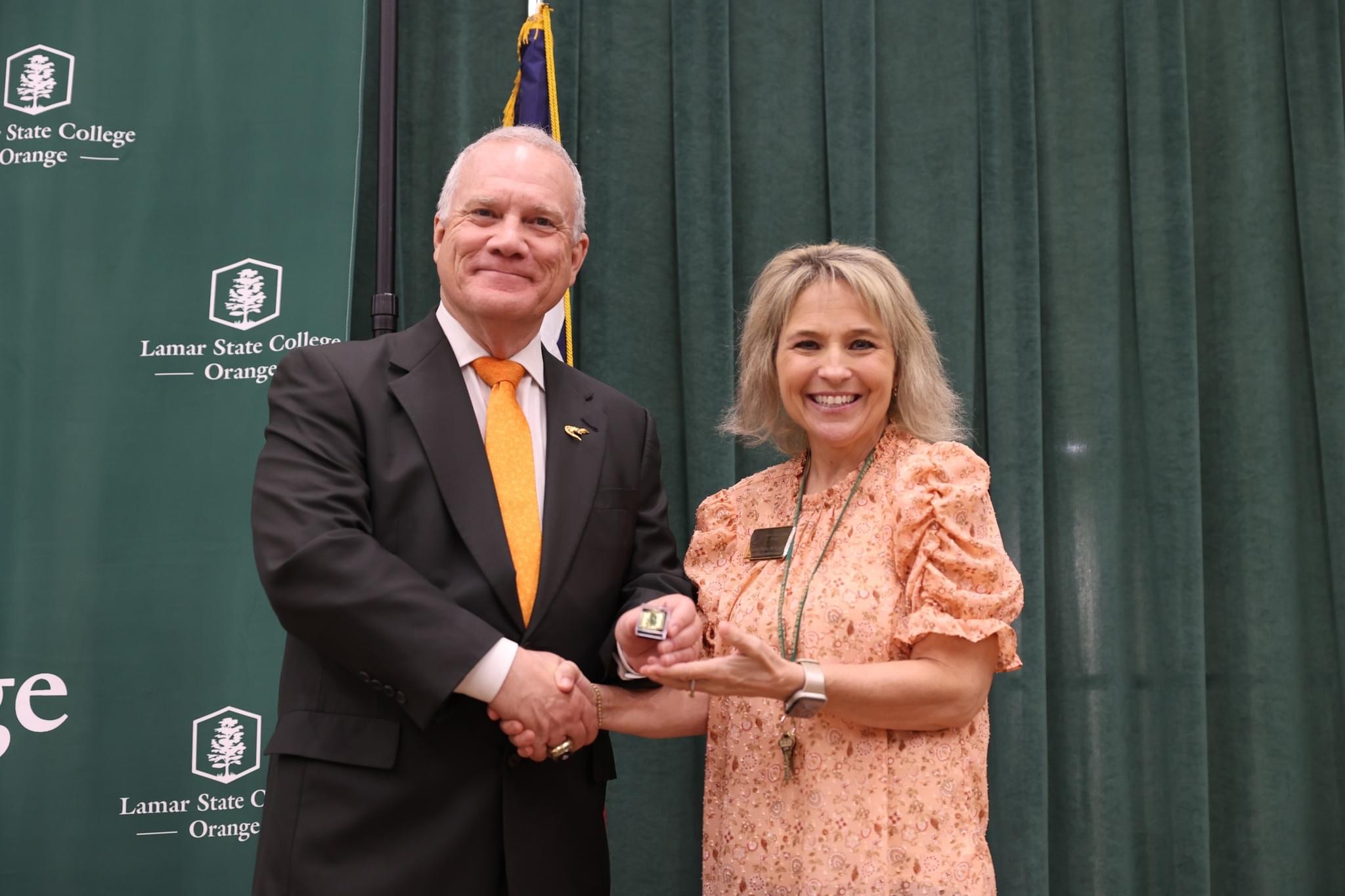 Dr. Johnson presents an award to Mandee Tucker