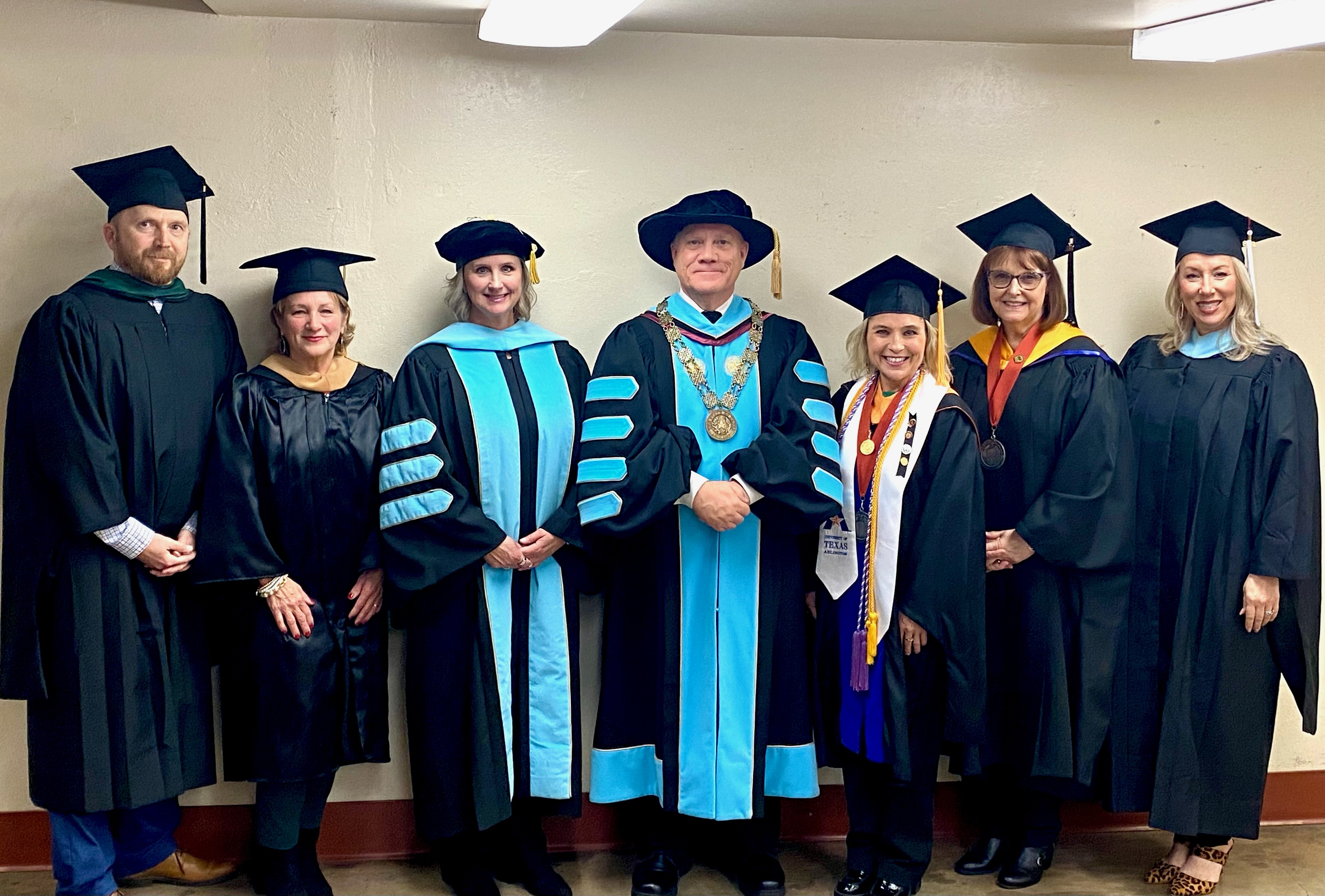 Dr. Johnson with faculty and staff in regalia