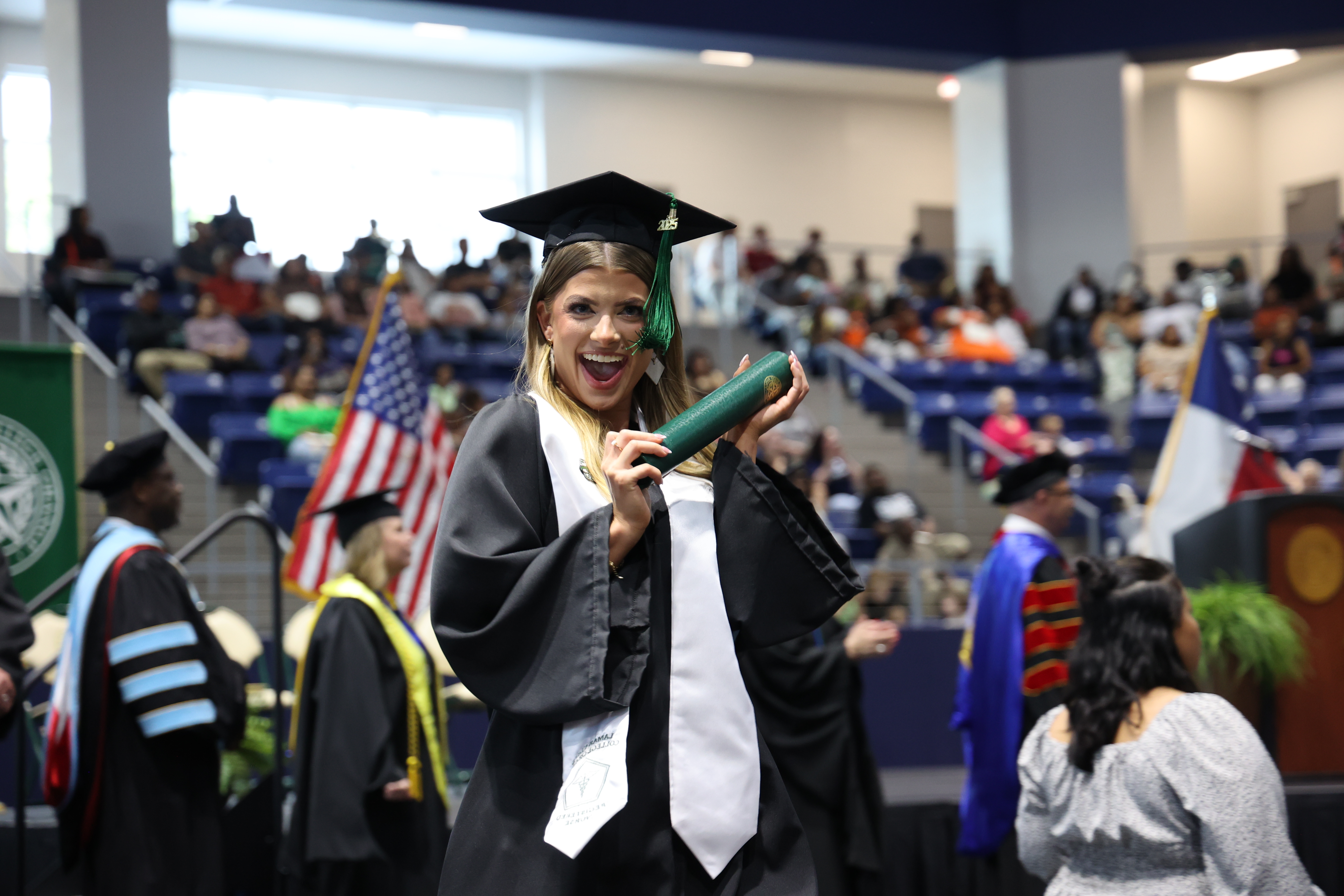 Student holding degree