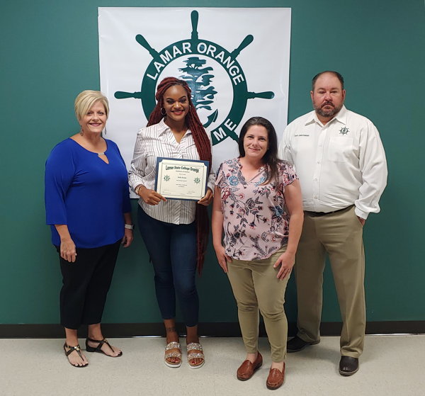 Dean Gina Simar, Halle Brown, WOS CTE Director Jenny Morgan, and Captain Chris Horner