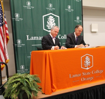 President Johnson and President Westbrook signing agreement