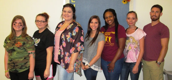 Seven student officers stand in a line