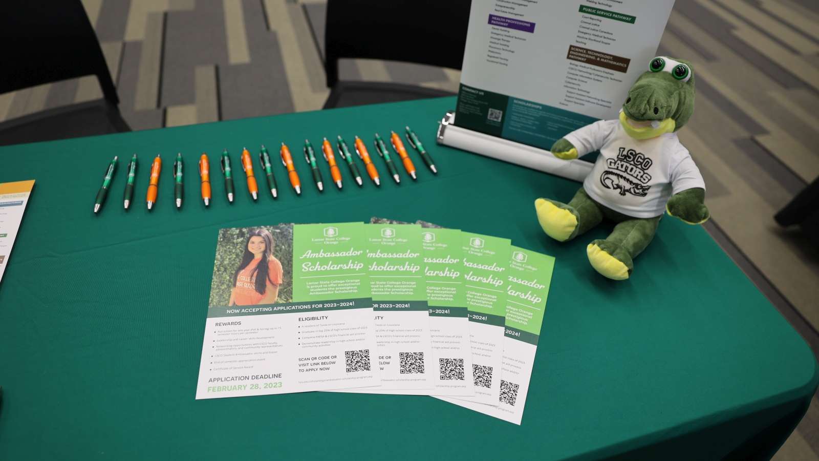 Table with flyers and pens