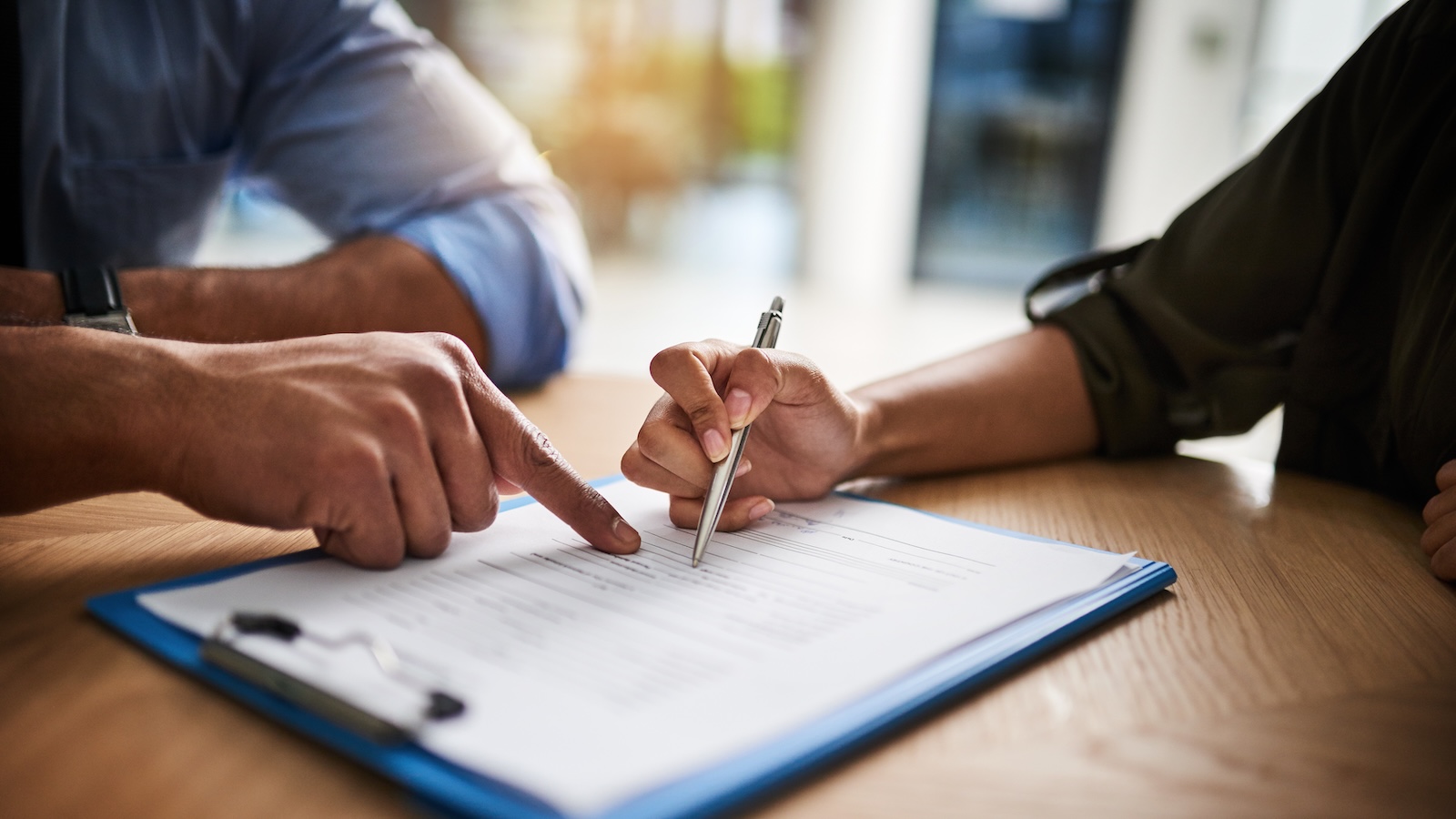 Two people reviewing a contract