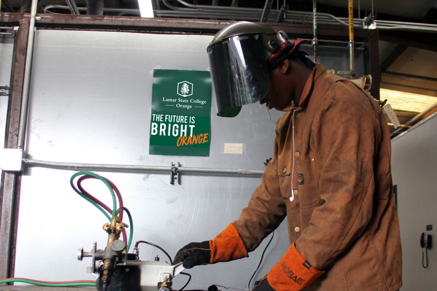 Welding student hands on