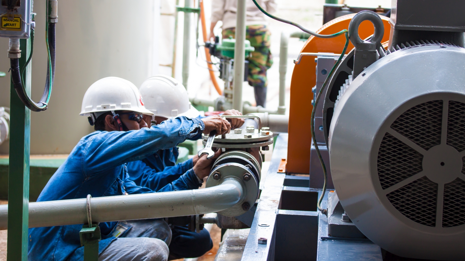 workers on industrial / manufacturing machine