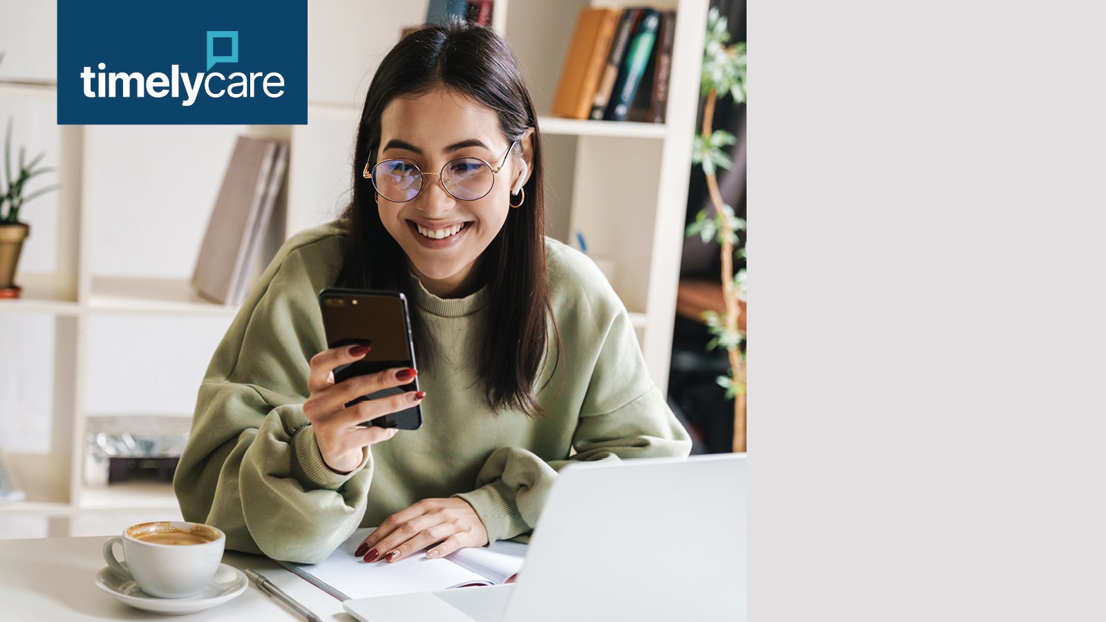 Student smiling at her cell phone